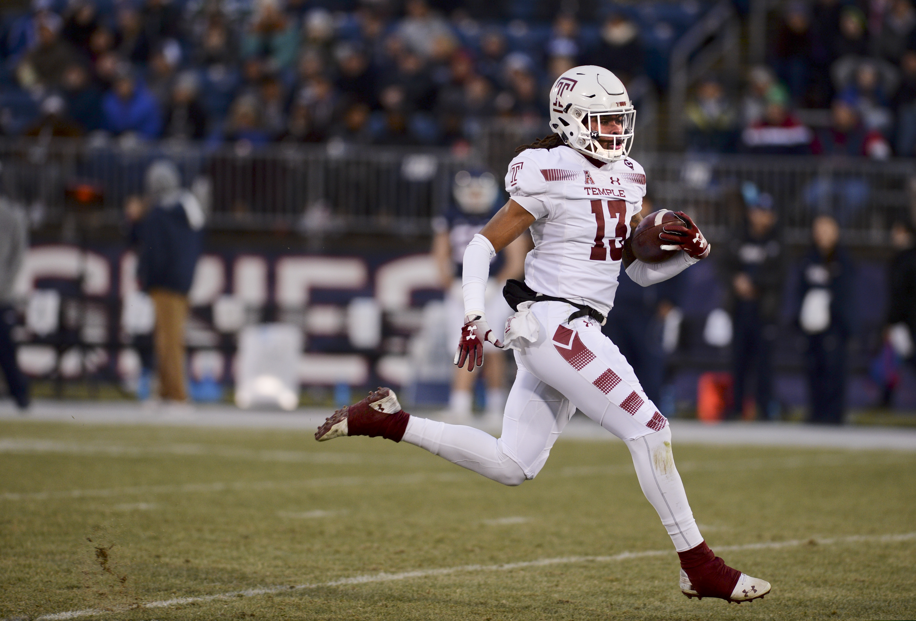 Isaiah Wright scores on a kickoff return during Temple's win over UConn last month.