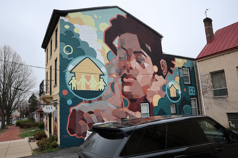 Noah Burns's mural, painted in 2022, is pictured on the former location of the Friends Association on West Chestnut Street. The mural could be removed after the building's new owner put a request before the borough's public arts commission.