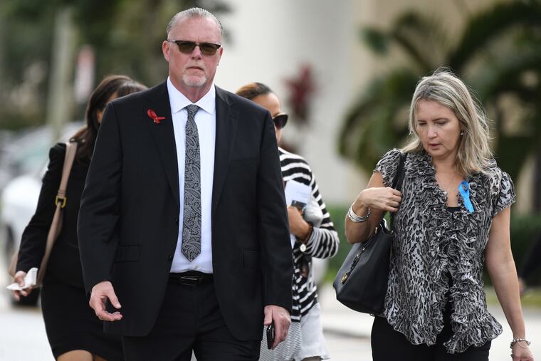 FILE - Marjory Stoneman Douglas principal Ty Thompson leaves the funeral services for Carmen Schentrup on Tuesday, Feb. 20, 2018, at St. Andrews Catholic Church in Coral Springs, Fla.