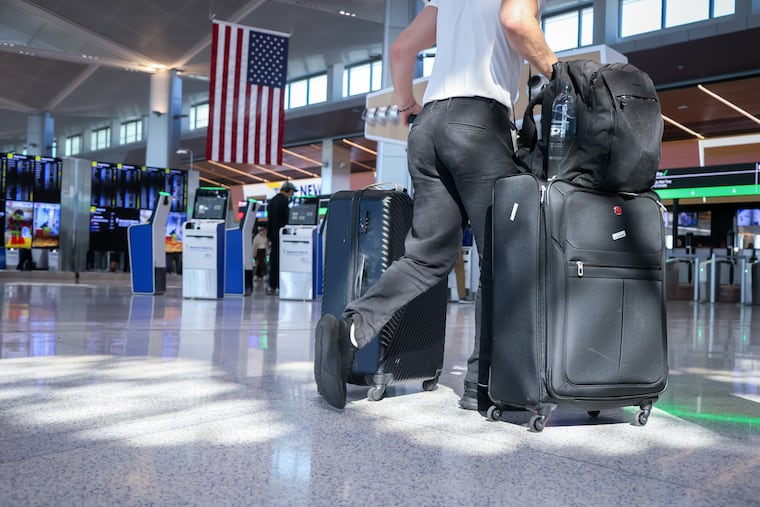 Travelers at Newark Liberty International Airport in Newark, New Jersey.