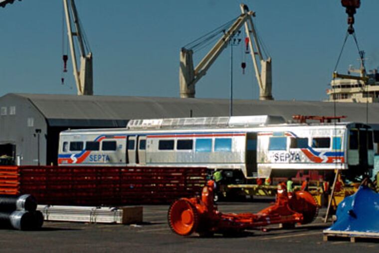 The shiny new railroad car in the Tioga Marine Terminal yard is the first prototype of the new SEPTA SilverlinerV rail cars. It was off-loaded from Korea Tuesday night. SEPTA has ordered 120 new Silverliners, and the railcars are to be assembled at a South Philadelphia plant. The new Silverliners will replace 73 railcars that were built for SEPTA in the 1960s. (Clem Murray/Inquirer)