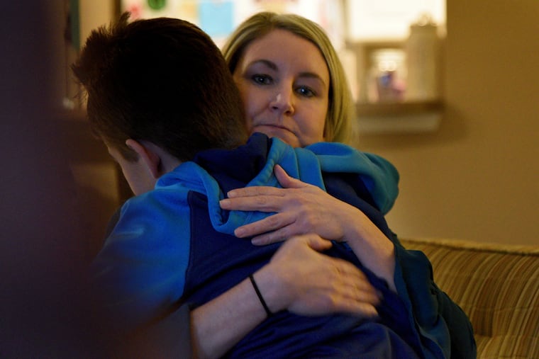 Marisa DiChiacchio hugs her son Connor Dobbyn at their Chester County home Jan. 13, 2020.