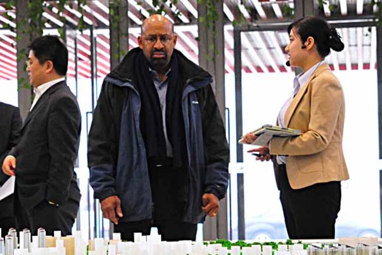 On his first working day in China, Mayor Nutter is briefed by Chinese officials on a $3-billion economic development zone, funded by the governments of China and Singapore. Staff photo by Jennifer Lin