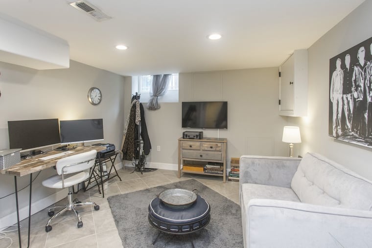 The fully finished basement has high ceilings, a half bath and a laundry room. It's currently used as an office/workout space.