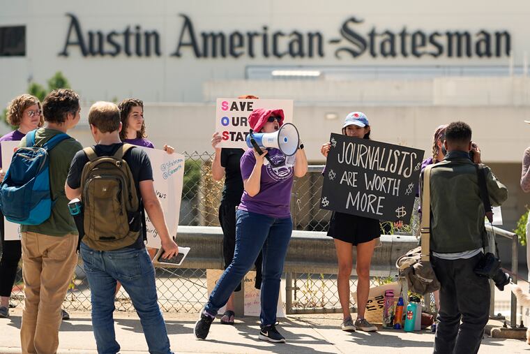 NewsGuild members of the Austin American-Statesman picketed in Austin, Texas, on Monday. The mostly one-day strike aimed to protest the company's leadership and cost-cutting measures imposed since its 2019 merger with GateHouse Media.