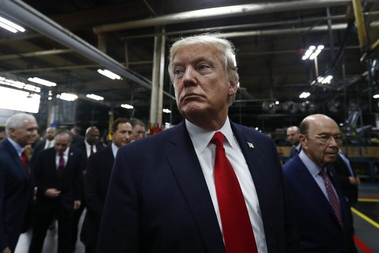 President Trump pauses as he talks to media before signing an Executive Order on the Establishment of Office of Trade and Manufacturing Policy at The AMES Companies, Inc., in Harrisburg in April.