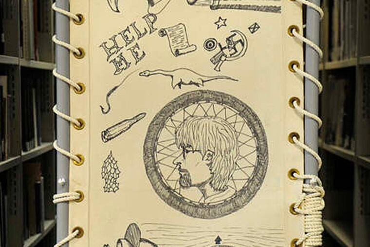 A section of one of the canvas bunks from the Gen. Nelson M. Walker troop transport ship in the library at the Independence Seaport Museum. This fall, the museum opened an exhibit featuring canvases marked by men from the Philadelphia area. A historian had records from the ship not known to federal authorities.