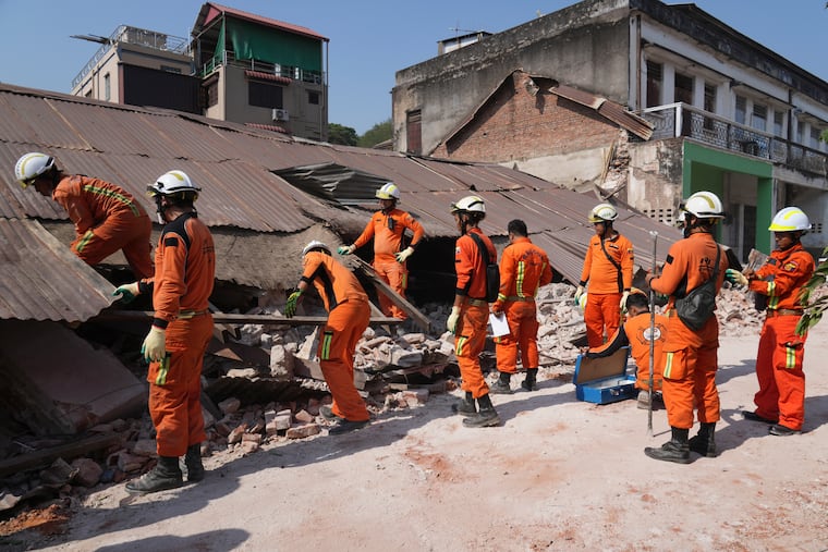 Myanmar's rescuers work through the rubble of a collapsed building following a deadly earthquake in Naypyitaw, Myanmar.