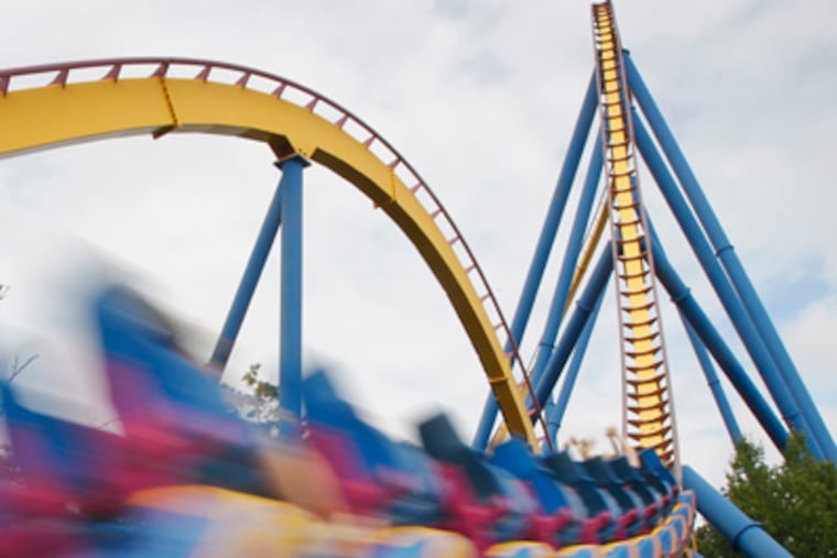 Picture of Club Theme Park Review members on the roller coaster Nitro as is speeds along its track. Members of Club Theme Park Review were at Six Flags Great Adventure in Jackson, New Jersey for a special early opening of the theme park on Thursday morning August 4, 2011. This group of theme park enthusiasts had the opportunity to ride the parks popular roller coasters before it was opened to the general public. Alejandro A. Alvarez / Philadelphia Daily News