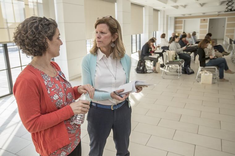 Maureen Fitzgerald (right) speaks with Kelly Herrenkohl, a representative of Vetri Community Partnership, which helps to sponsor My Daughter’s Kitchen.