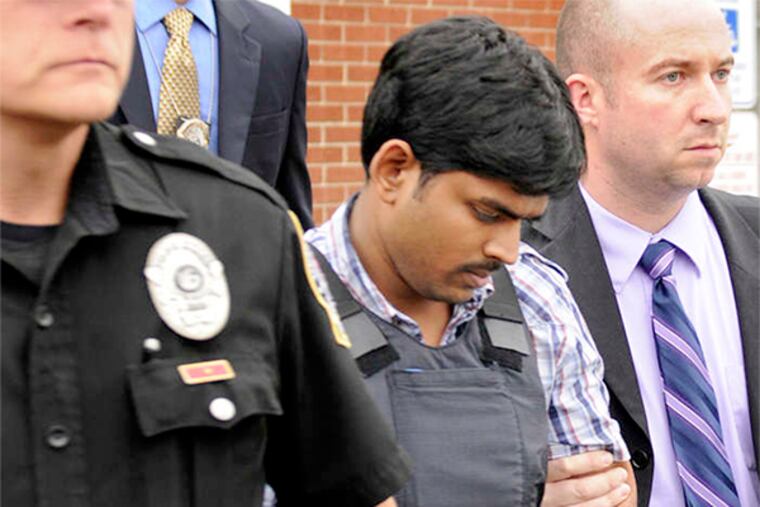 Raghunandan Yandamuri (center) has been charged in the deaths of a baby and her grandmother.