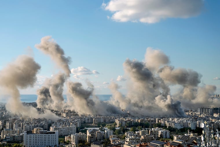 Smoke rises following an Israeli airstrike on Dahiyeh, in Beirut, Lebanon, on Tuesday.
