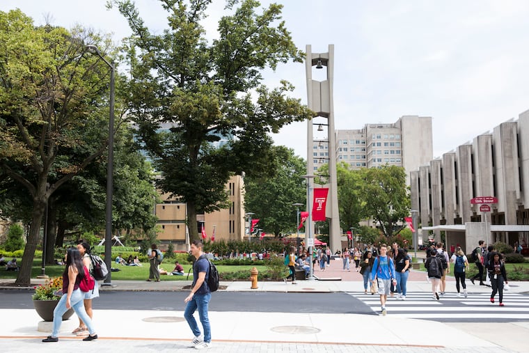 Students walk through the Temple University campus on the first day of the fall semester in August.