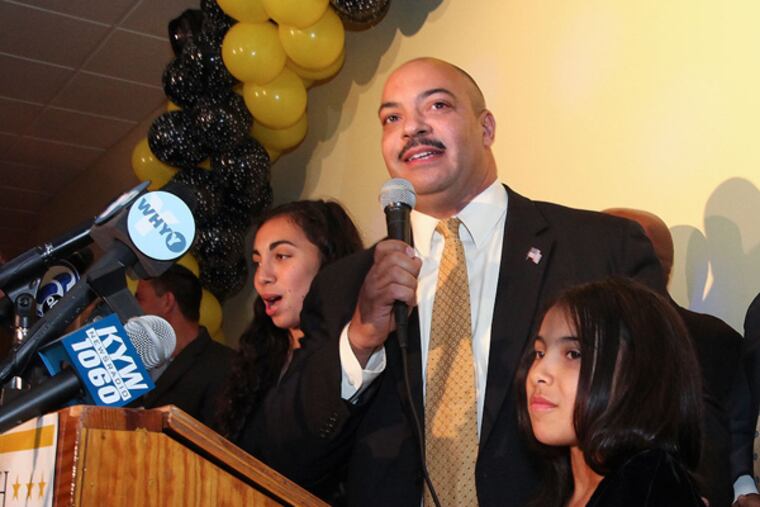 DA Seth Williams makes victory speech with daughters Taylor, left and Hope by his side in South Philadelphia, Tuesday, November 5, 2013.( Steven M. Falk / Staff Photographer )