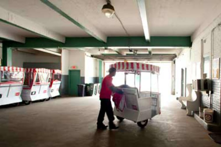 A worker heads for the Boardwalk with his Royal Rolling Chair as he leaves the company's garage on New York Avenue in Atlantic City.