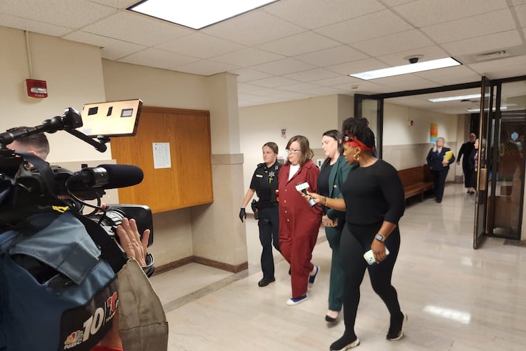 Verity Beck is led from a Montgomery County Courtroom after pleading guilty but mentally ill in the killing and dismembering of her parents in January 2023.