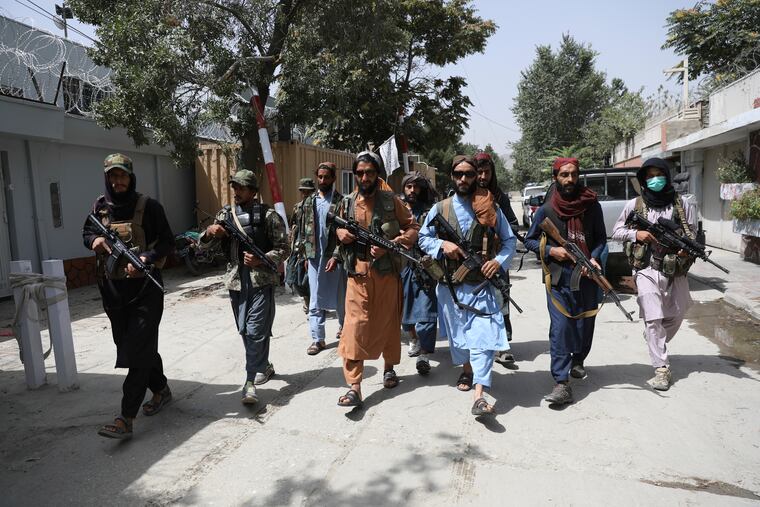 Taliban fighters patrol in the Wazir Akbar Khan neighborhood of Kabul, Afghanistan, on Wednesday.