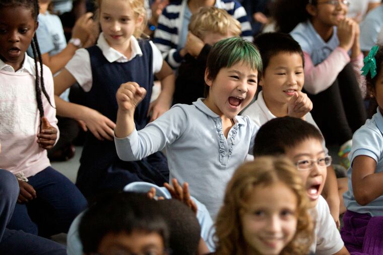 Student Lily Dominus, 8, cheers as she hears the news that Penn Alexander was among the recipients of the National Blue Ribbon Award.
