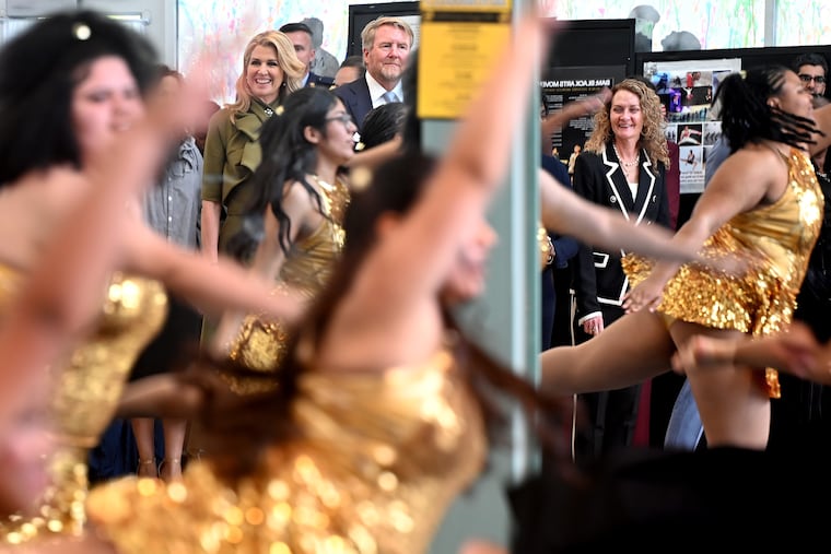 His Majesty King Willem-Alexander and Her Majesty Queen Máxima of the Kingdom of the Netherlands (left) are reflected in the dance studio mirror as they watch a student performance during their visit Monday, April 13, 2026 to Kensington High School for the Creative and Performing Arts. At right is principal Patricia McDermott.