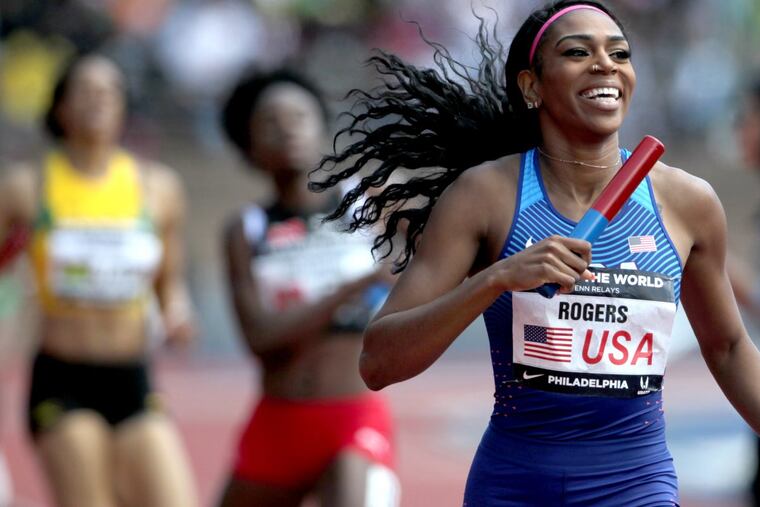 Raevyn Rogers smiles after her team won the USA vs. the World women’s sprint medley in world record time at the Penn Relays on April 28, 2018.