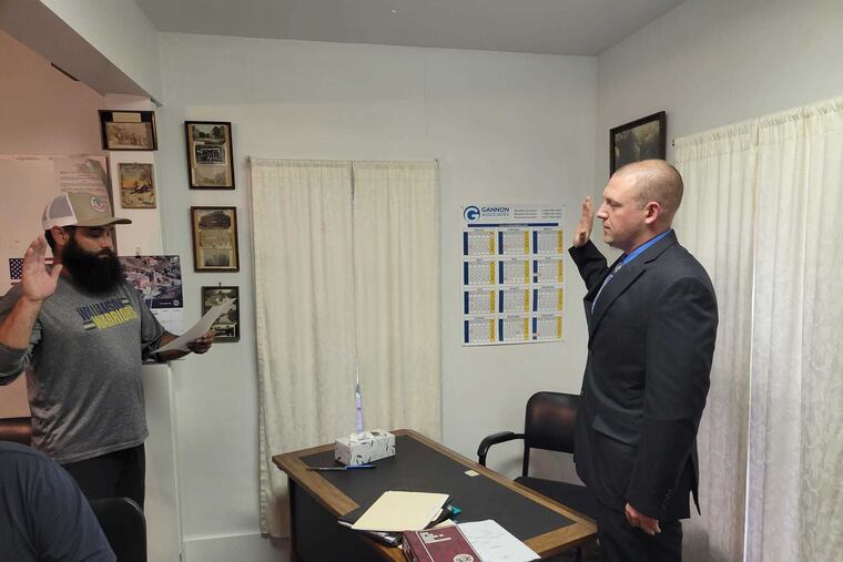 A photo posted on Facebook by Tioga Borough Council President Steve Hazlett shows the swearing in of Timothy Loehmann as Tioga borough police officer.