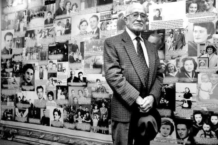 Max Bouton, 86, of Cherry Hill, before Holocaust photographs . His story has been documented in the exhibit by the Holocaust Education Center of the Delaware Valley. After being taken by Nazi soldiers in 1942, he spent 3 years in concentration camps.
