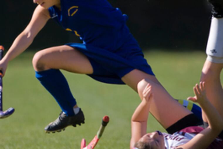 Bridgette Mooney of Kennedy-Kenrick (left) collides with Shannon Murray.
