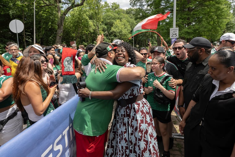 Philadelphia Mayor Cherelle Parker embraces Mexican soccer fan Juan Flores after joining fans in a Mexican chant before entering the FIFA Fan Festival at Lemon Hill on opening day of the FIFA World Cup 2026 on Thursday, June 11, 2026, in Philadelphia. Fans gathered to watch Mexico face South Africa in the tournament's opening match.