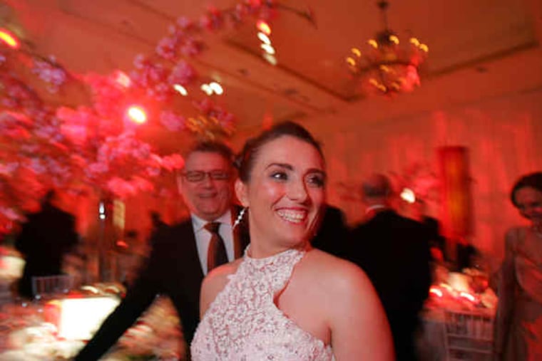 At the Viva la Diva Gala, Brian Kappra of Evantine Design, who donated the decor and flowers for the room at the Four Seasons Hotel, smiles at soprano Ermonela Jaho. The black-tie benefit raised $150,000 for the Opera Company of Philadelphia.