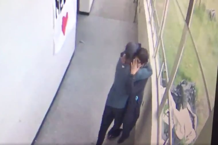 Keanon Lowe and a student emerge from a classroom and into a hallway at Parkrose High School with Lowe in possession of the shotgun in this screen grab from video released Friday by the Multnomah County District Attorney's Office.