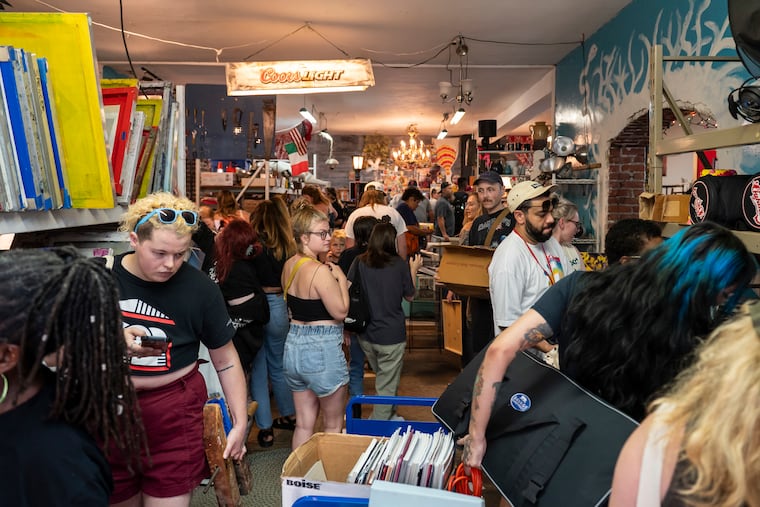 Former students, faculty, and staff of University of the Arts browse through Thunderbird Hall in Kensington, where Thunderbird Salvage is hosting a pop-up sale of items taken from the university’s Anderson Hall after it shut down last year.