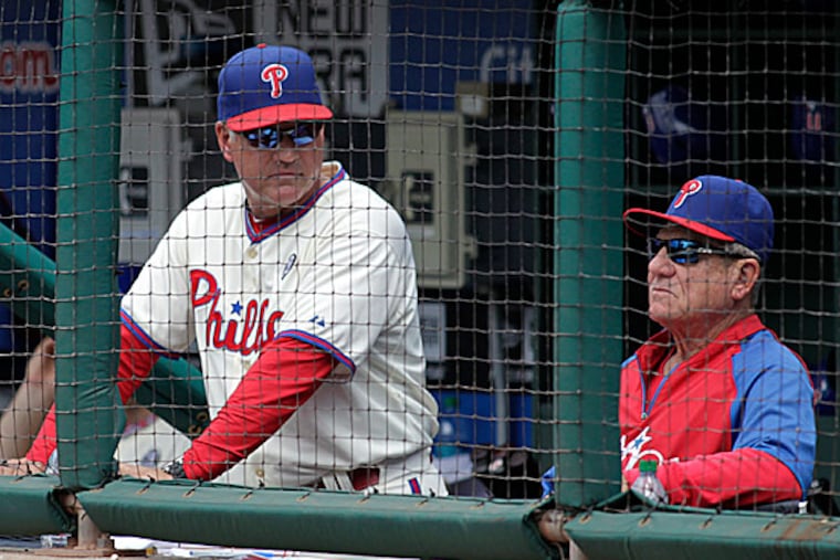 Phillies manager Ryne Sandberg and bench coach Larry Bowa. (H. Rumph Jr/AP)
