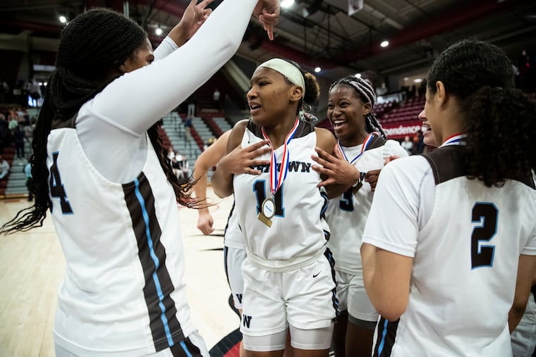 Joniyah Bland-Fitzpatrick of Westtown celebrates with teammates after winning the PAISAA Championship game at Hagan Arena. Westtown defeated Penn Charter 74-54.