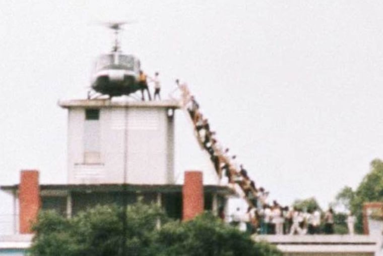 In 1975, Vietnamese evacuees wait to board an American helicopter near the U.S. Embassy. Rory Kennedy's documentary "Last Days in Vietnam" delves behind the images.