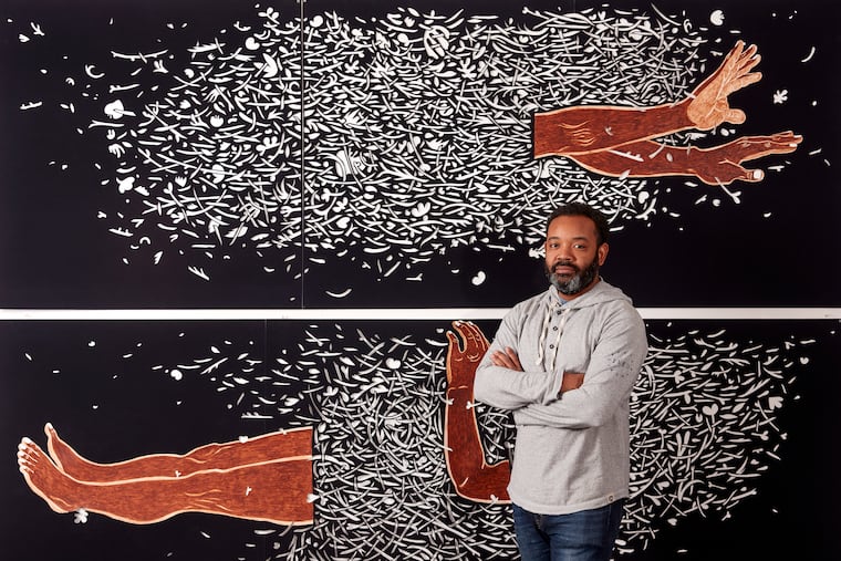 Artist William Villalongo in front of his mixed-media paintings "Zero Gravity 1" (top) and "Zero Gravity 2." The exhibit "William Villalongo: Myths and Migrations" runs May 15 through Aug. 31 at the Pennsylvania Academy of the Fine Arts.
