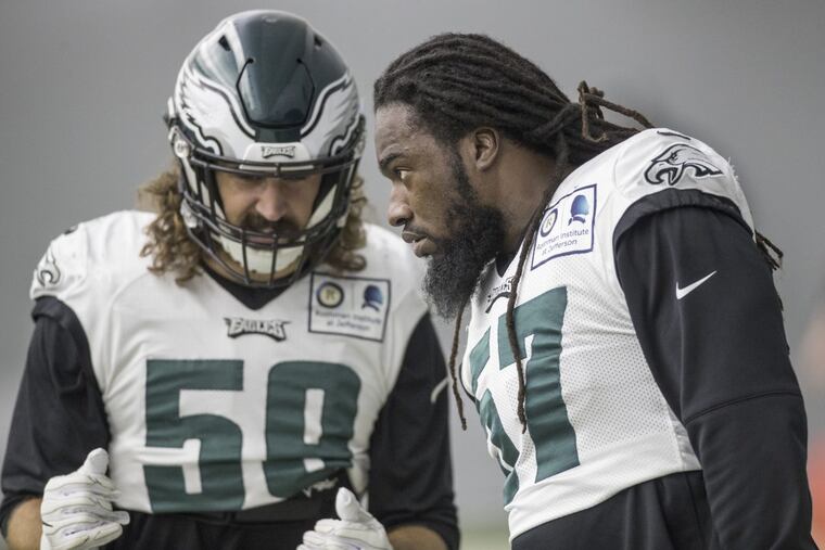 New Eagle linebacker Dannell Ellerbe, #57, right, listens to fellow linebacker Joe Walker, #59, left, during a special teams drill at the indoor practice at the NovaCare Center on Wednesday November 22, 2017.