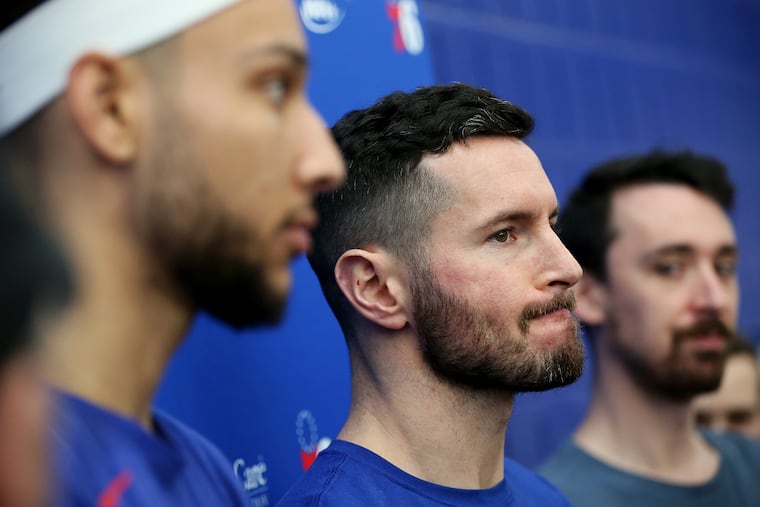 The Sixers' Ben Simmons, foreground, and JJ Redick talk to reporters after practice Saturday.