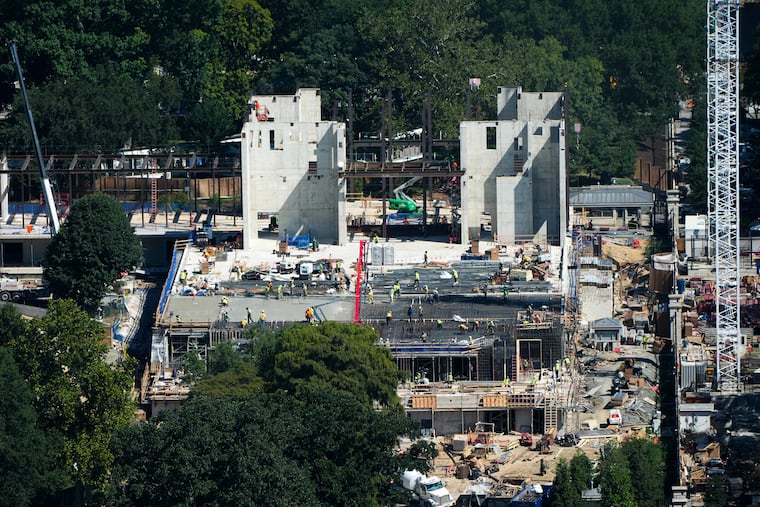 Workers continue construction on the new White House ballroom, as seen from the Washington Monument, Wednesday, Aug. 19, 2026, in Washington.