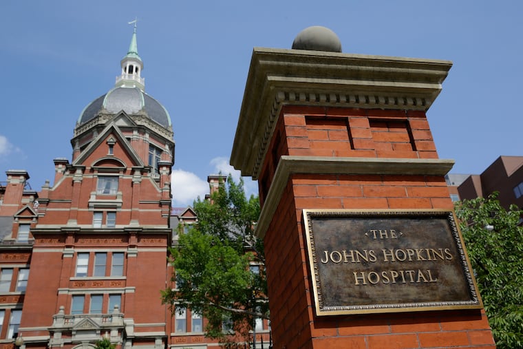 A sign stands in front of part of the Johns Hopkins Hospital complex in Baltimore. Most medical students at Johns Hopkins University will no longer pay tuition thanks to a $1 billion gift from Bloomberg Philanthropies.