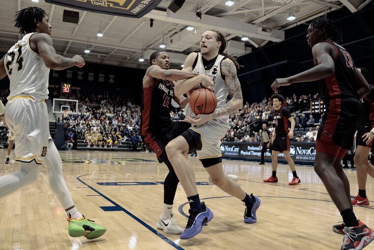 Mac Etienne, center, who transferred to La Salle this past season, will forego his remaining eligibility to pursue a professional basketball career.