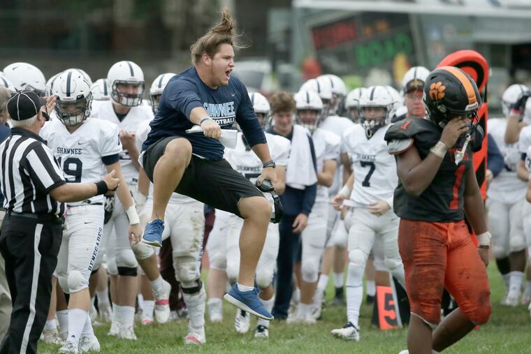 Shawnee assistant coach Jake Pisarcik celebrates during a game earlier this season.