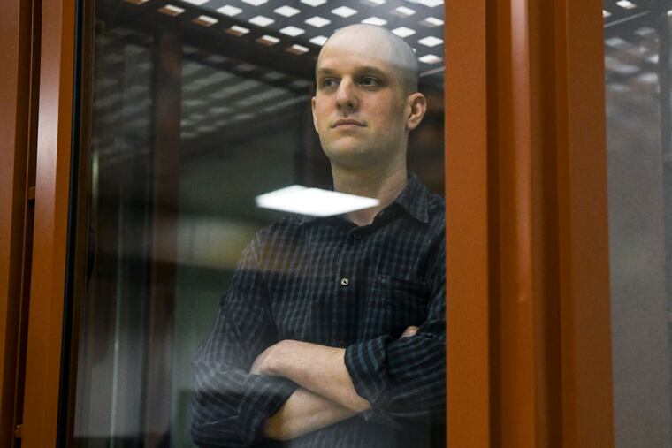 Wall Street Journal reporter Evan Gershkovich stands in a glass cage in a courtroom in Yekaterinburg, Russia, on June 26, 2024.