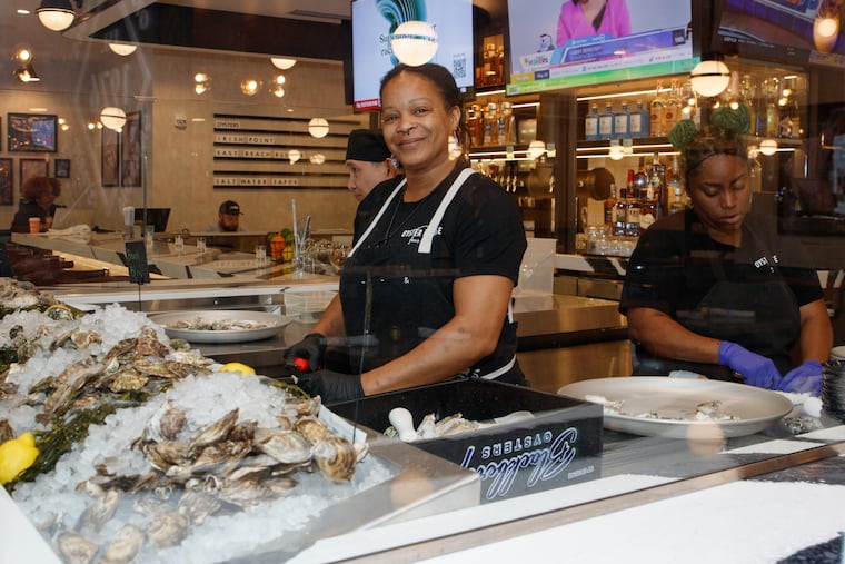 A shucker at Oyster House at Philadelphia International Airport.