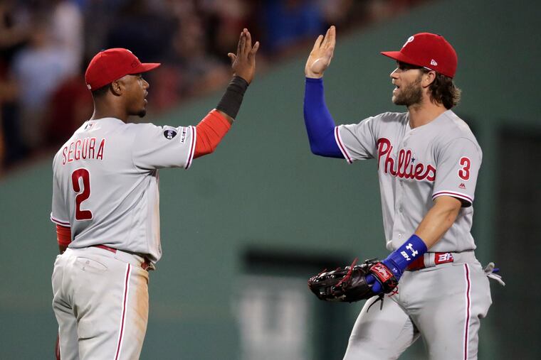 Bryce Harper (right) and teammate Jean Segura are one-two in "clutch" rankings.