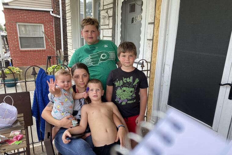 The family of Christopher Currid, 4, who was critically injured by a hit-and-run driver, await word of his condition Monday, August 17, 2020. Pictured are the child's cousin Stephanie Sweet, seated holding cousin Mason. Clockwise, bother Bobby, cousin Michael O'Toole, and brother Andrew