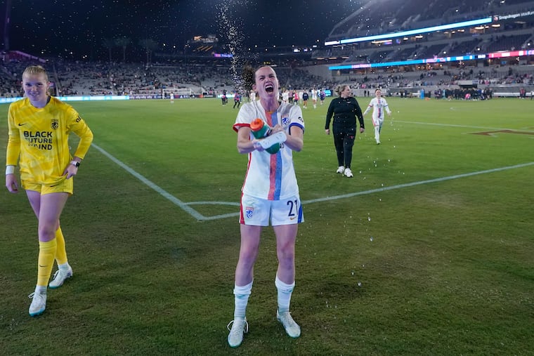 Phoebe McClernon celebrates on the field after helping OL Reign take down the San Diego Wave in the NWSL playoff semifinals. The Reign will play again in San Diego on Saturday in the title game.