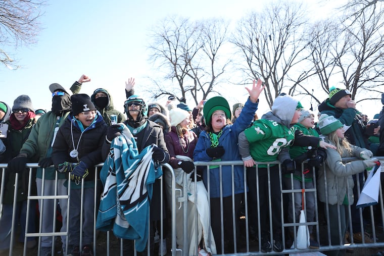 Fans along Broad Street greet players during the Eagles Super Bowl LIX victory parade Friday.