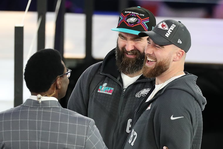 Former Eagles center Jason Kelce (center) and Chiefs tight end Travis Kelce before Super Bowl LVII in 2023.
