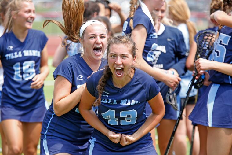 Villa Maria players, including Sarah Delaney (front left) and Maggie Powers (43), celebrate after the Hurricanes won the PIAA Class 2A girls' lacrosse championship.
