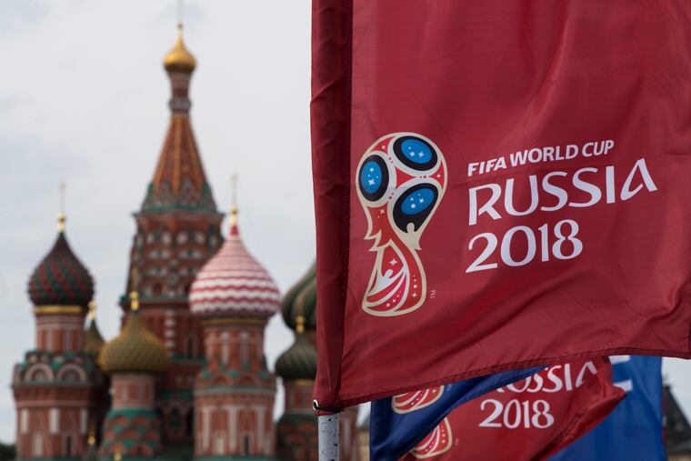 A flag with Russia's 2018 World Cup logo flies outside of St. Basil's Cathedral in Moscow's Red Square.
